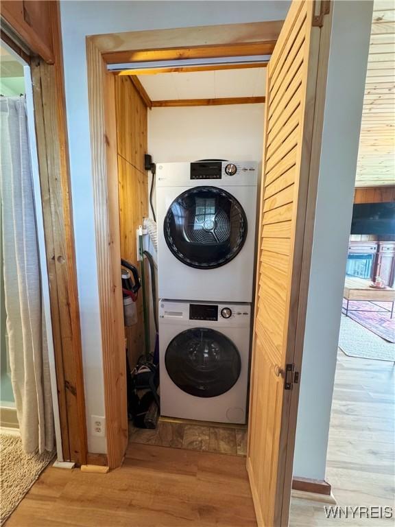 15794 W Lake Rd, Pulteney, NY 14874 - washroom with stacked washing machine and dryer and light wood finished floors