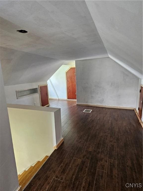 203 Windemere Rd, Geddes, NY 13219 - bonus room featuring lofted ceiling and dark wood-style floors