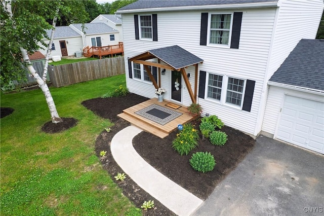 150 E Hawthorne Way, Sullivan, NY 13037 - traditional-style house with a shingled roof, a garage, a deck, and asphalt driveway