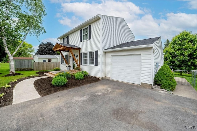 150 E Hawthorne Way, Sullivan, NY 13037 - view of front of house with a garage and asphalt driveway
