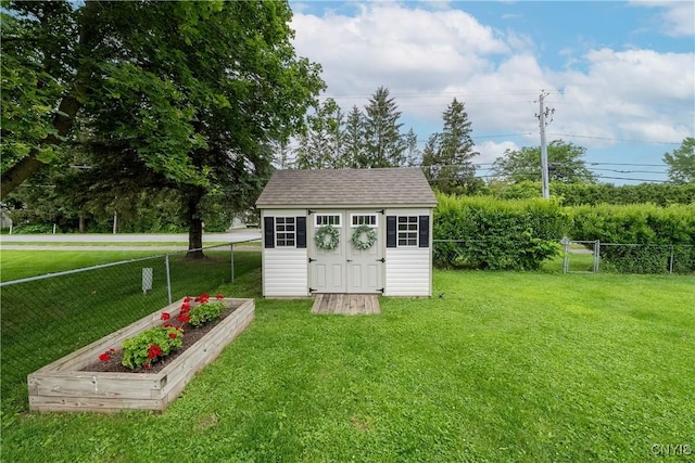 150 E Hawthorne Way, Sullivan, NY 13037 - view of shed featuring a fenced backyard and a vegetable garden