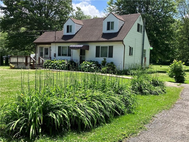 1300 Cain Rd, Porter, NY 14174 - cape cod home featuring a front yard, a deck, and a shingled roof
