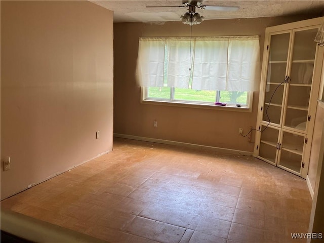 1300 Cain Rd, Porter, NY 14174 - spare room featuring a ceiling fan and baseboards