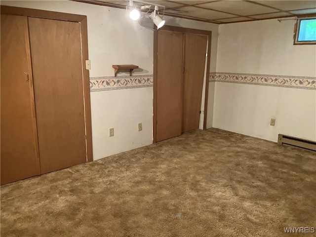 1300 Cain Rd, Porter, NY 14174 - unfurnished bedroom featuring baseboard heating, carpet, and ceiling fan