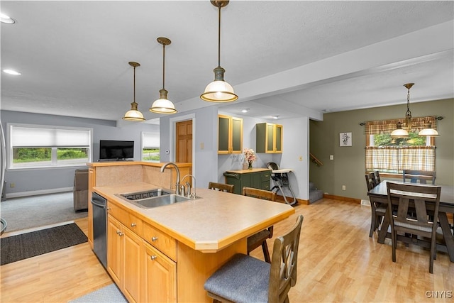 10327 Wolcott Hill Rd, Camden, NY 13316 - kitchen with an island with sink, light wood-style flooring, recessed lighting, light countertops, and dishwashing machine