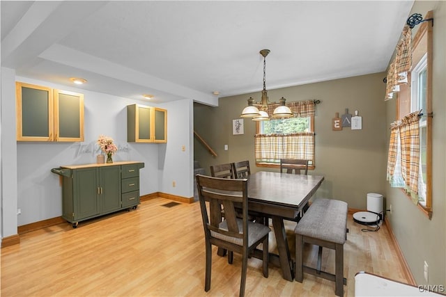 10327 Wolcott Hill Rd, Camden, NY 13316 - dining space featuring light wood-style flooring and a chandelier