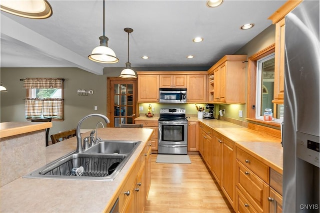 10327 Wolcott Hill Rd, Camden, NY 13316 - kitchen featuring stainless steel appliances, light countertops, recessed lighting, light wood-type flooring, and decorative light fixtures
