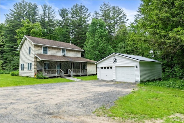 10327 Wolcott Hill Rd, Camden, NY 13316 - view of front of house featuring an outdoor structure, a garage, a front lawn, and covered porch