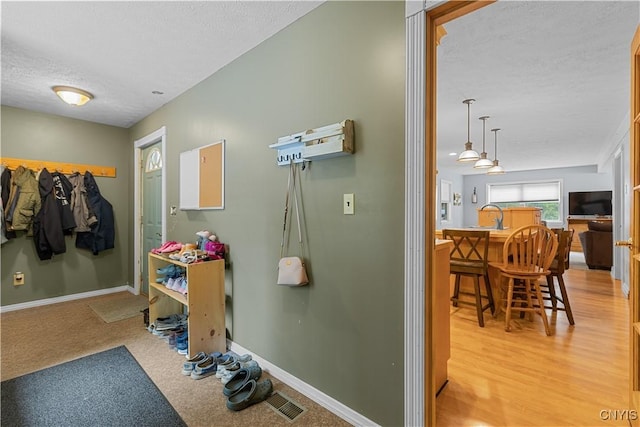 10327 Wolcott Hill Rd, Camden, NY 13316 - bathroom featuring a textured ceiling and baseboards