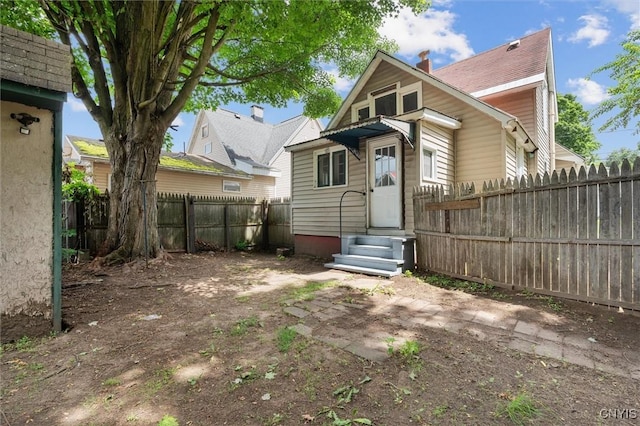 364 S 6th St, Fulton, NY 13069 - rear view of house featuring entry steps and a fenced backyard