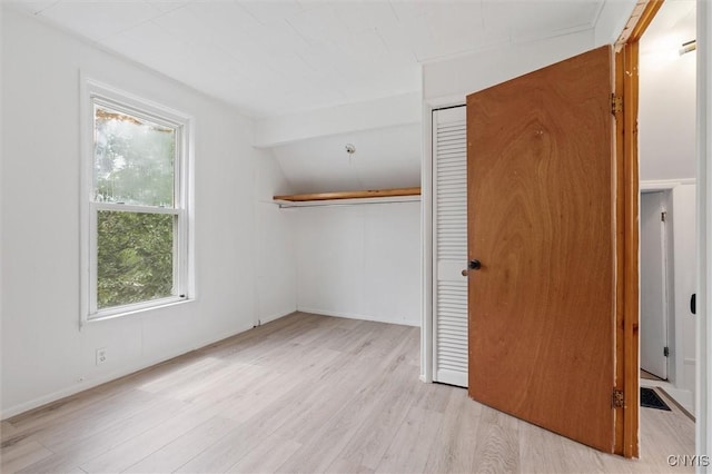 364 S 6th St, Fulton, NY 13069 - unfurnished bedroom with a closet, wood finished floors, and vaulted ceiling