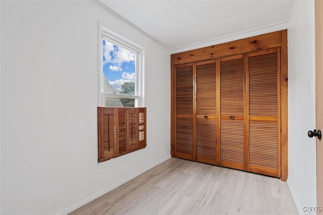364 S 6th St, Fulton, NY 13069 - unfurnished bedroom featuring light wood-type flooring and a closet