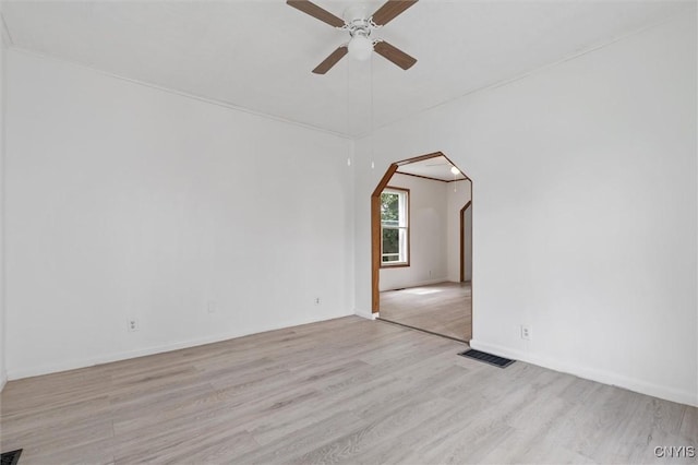 364 S 6th St, Fulton, NY 13069 - unfurnished room featuring ceiling fan, arched walkways, and light wood-style flooring