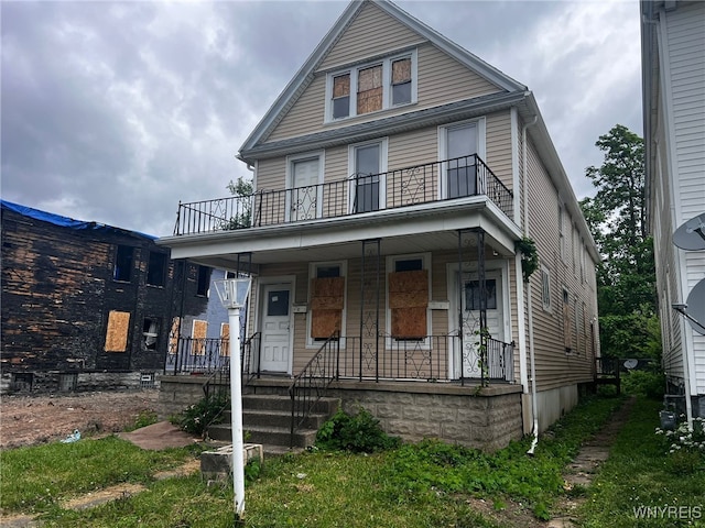 506 Glenwood Ave, Buffalo, NY 14208 - american foursquare style home featuring a balcony and a porch