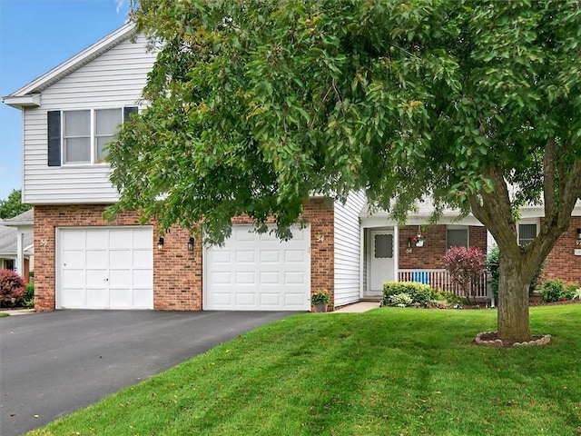 54 Flower Dale Cir, Greece, NY 14626 - view of property hidden behind natural elements with brick siding, driveway, and a front lawn