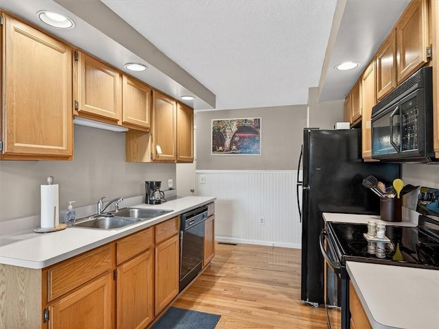 54 Flower Dale Cir, Greece, NY 14626 - kitchen featuring black appliances, wainscoting, light countertops, light wood finished floors, and recessed lighting
