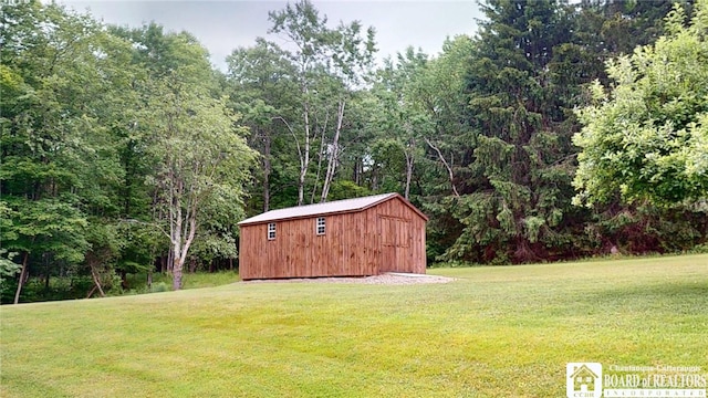 12483 Sawmill Run Rd, South Valley, NY 14738 - view of green lawn featuring a storage shed and a wooded view