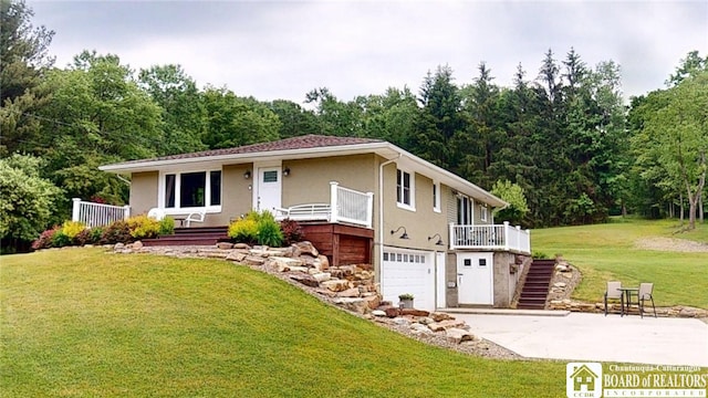 12483 Sawmill Run Rd, South Valley, NY 14738 - ranch-style house with a garage, driveway, stucco siding, a front yard, and stairs