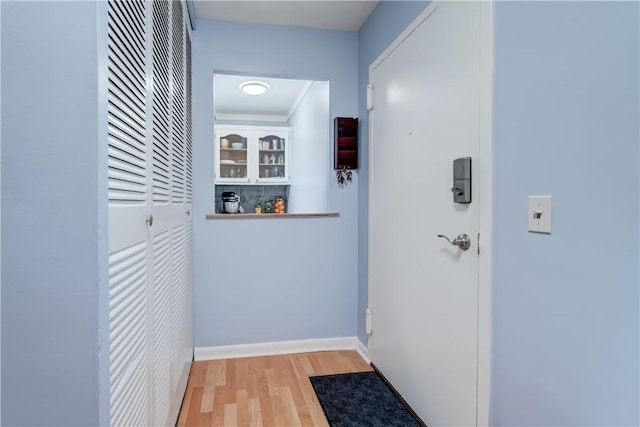1400 E Ave Unit Un609, Rochester, NY 14610 - hall featuring light wood-type flooring and baseboards