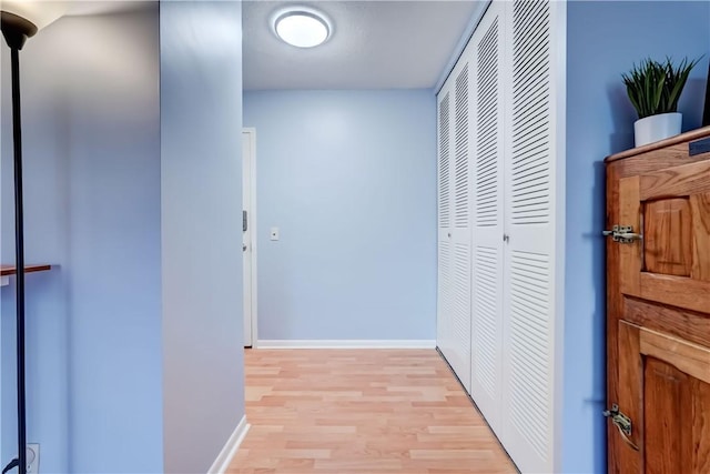 1400 E Ave Unit Un609, Rochester, NY 14610 - hallway featuring light wood-style flooring and baseboards