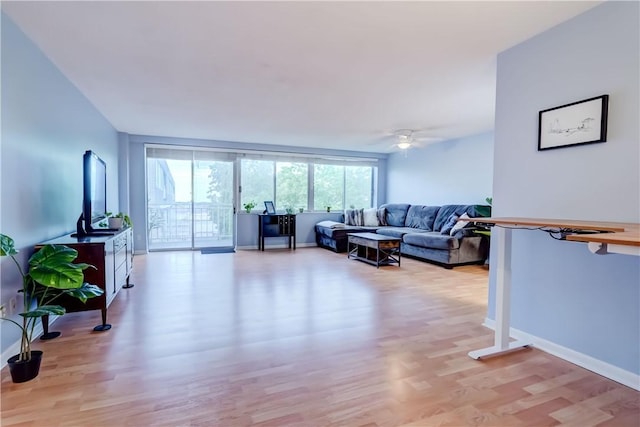 1400 E Ave Unit Un609, Rochester, NY 14610 - living area featuring light wood-type flooring and ceiling fan