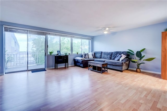 1400 E Ave Unit Un609, Rochester, NY 14610 - living room with light wood-style flooring and a ceiling fan