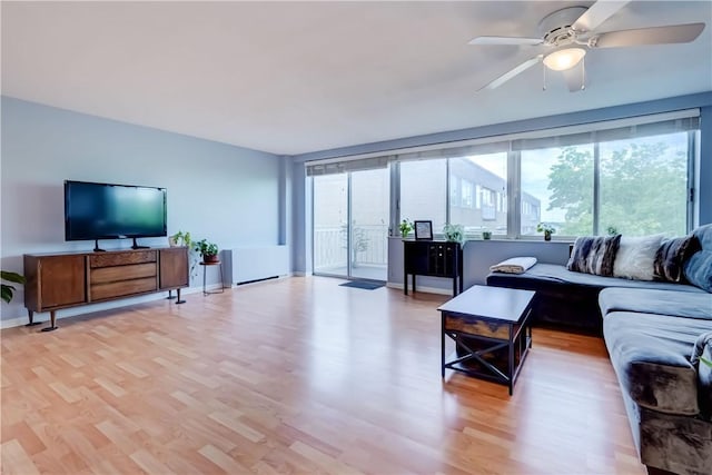 1400 E Ave Unit Un609, Rochester, NY 14610 - living room with plenty of natural light, light wood-style flooring, and a ceiling fan