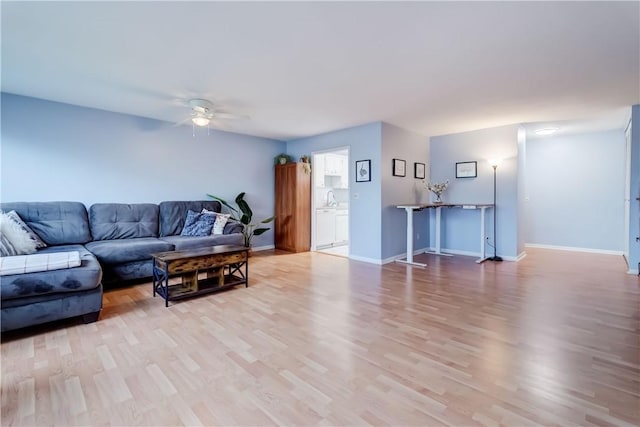 1400 E Ave Unit Un609, Rochester, NY 14610 - living area with a ceiling fan and light wood finished floors