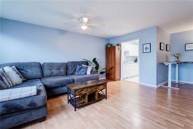 1400 E Ave Unit Un609, Rochester, NY 14610 - living area featuring a ceiling fan and light wood-type flooring