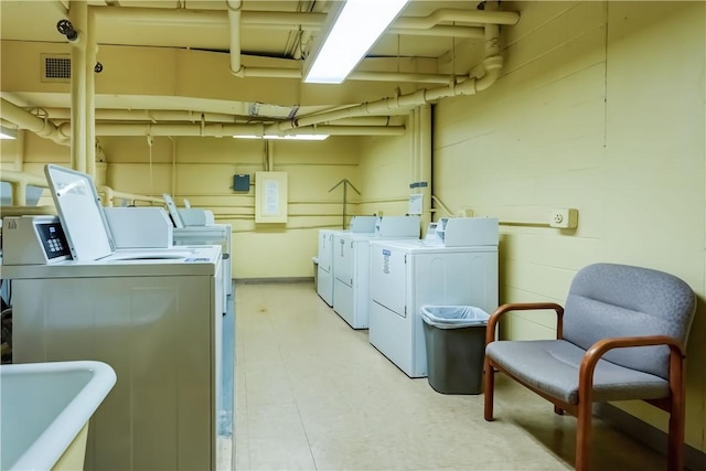1400 E Ave Unit Un609, Rochester, NY 14610 - laundry area featuring washer and dryer and a sink