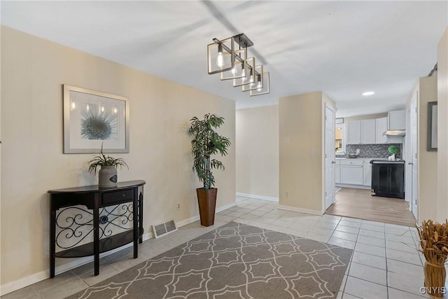 4302 Cinnamon Path, Clay, NY 13090 - foyer entrance featuring light tile patterned floors and baseboards