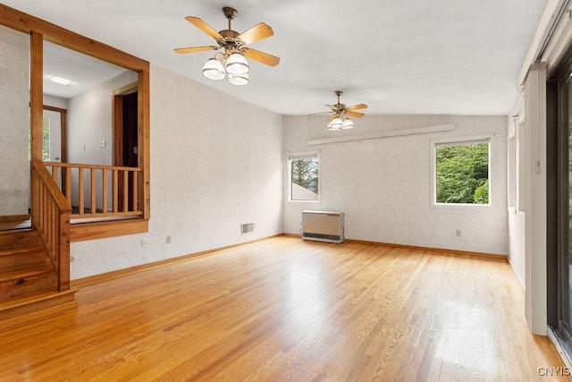 2361 E Hill Rd, Preble, NY 13077 - spare room with light wood-type flooring, healthy amount of natural light, a ceiling fan, and stairs