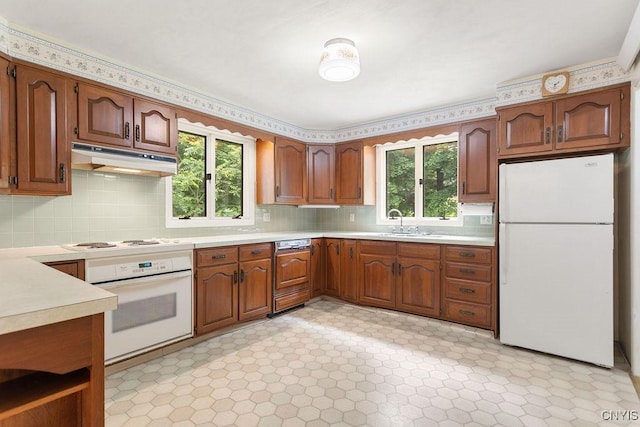 2361 E Hill Rd, Preble, NY 13077 - kitchen featuring white appliances, light countertops, under cabinet range hood, and decorative backsplash