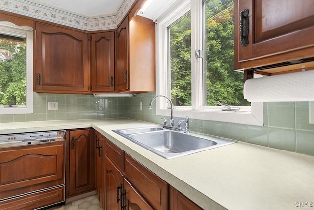 2361 E Hill Rd, Preble, NY 13077 - kitchen with dishwashing machine, plenty of natural light, light countertops, and tasteful backsplash