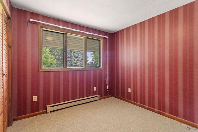 2361 E Hill Rd, Preble, NY 13077 - carpeted empty room with a baseboard heating unit
