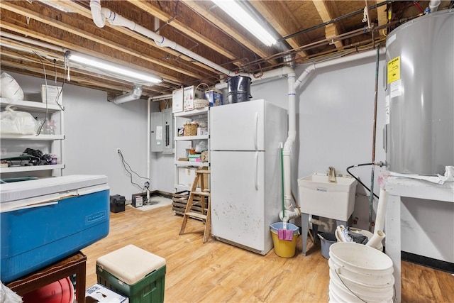 5107 County Road 36, Richmond, NY 14471 - unfinished basement featuring freestanding refrigerator, electric panel, and wood finished floors