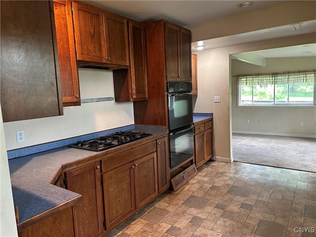 8362 Price Rd, Floyd, NY 13354 - kitchen featuring black appliances, dark countertops, and brown cabinets