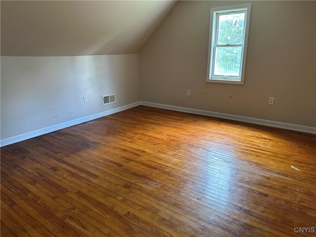 8362 Price Rd, Floyd, NY 13354 - additional living space with vaulted ceiling and dark wood finished floors