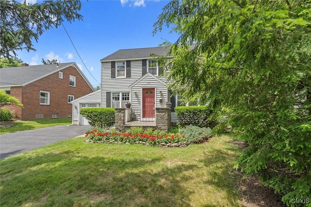 312 S Orchard Rd, Geddes, NY 13219 - view of front of property with asphalt driveway, a front yard, and a garage