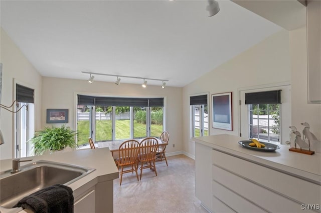 312 S Orchard Rd, Geddes, NY 13219 - kitchen with track lighting, light countertops, healthy amount of natural light, and light tile patterned flooring