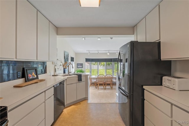 312 S Orchard Rd, Geddes, NY 13219 - kitchen with dishwasher, light countertops, light tile patterned floors, and white cabinetry