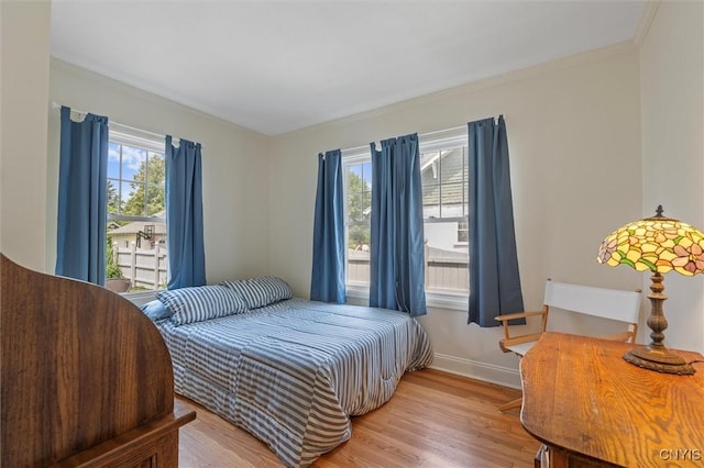 312 S Orchard Rd, Geddes, NY 13219 - bedroom with light wood finished floors and crown molding