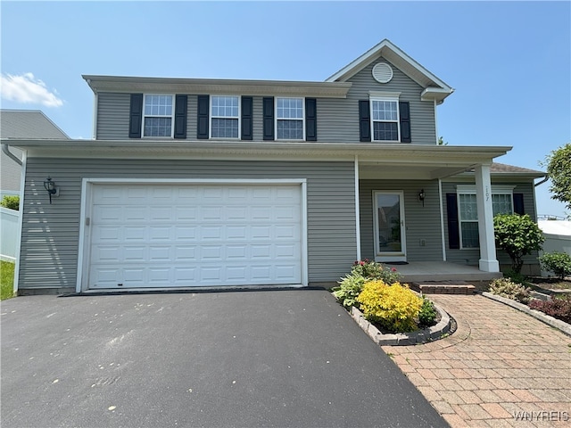 107 Naymik Dr, Sullivan, NY 13037 - traditional-style house with a porch, asphalt driveway, and a garage