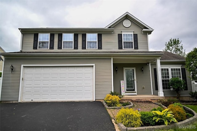 107 Naymik Dr, Sullivan, NY 13037 - traditional home with a porch, a garage, and asphalt driveway