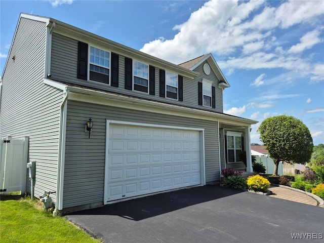 107 Naymik Dr, Sullivan, NY 13037 - view of front of house with a garage and asphalt driveway