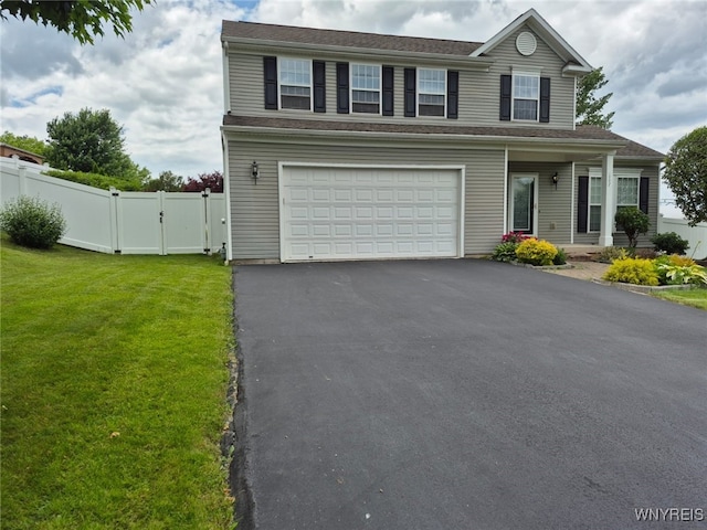 107 Naymik Dr, Sullivan, NY 13037 - traditional home featuring a gate, asphalt driveway, and an attached garage