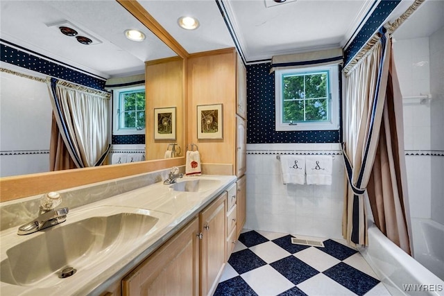 87 Old Spring Ln, Amherst, NY 14221 - bathroom featuring healthy amount of natural light, double vanity, crown molding, shower / bath combo, and tile patterned floors