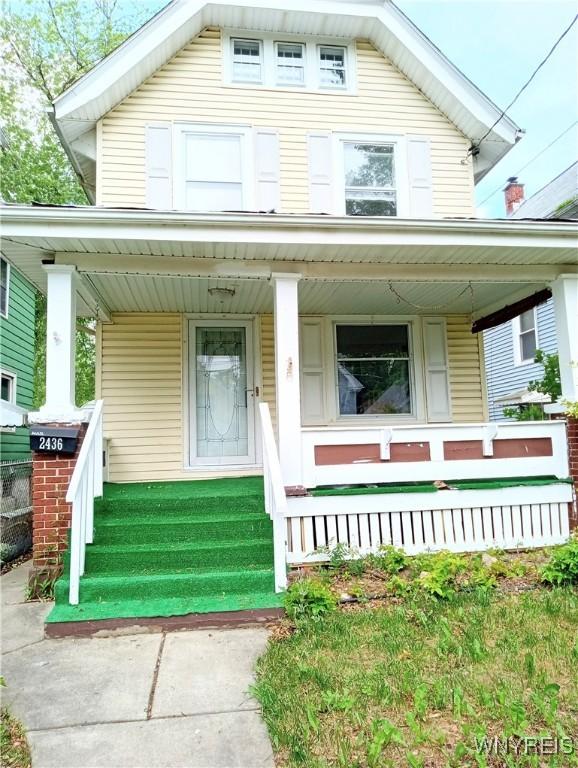 2436 Cleveland Ave, Niagara Falls, NY 14305 - american foursquare style home featuring a porch