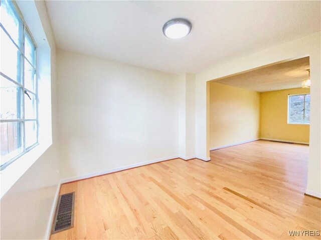 23 Bennett Village Ter, Buffalo, NY 14214 - unfurnished room with wood finished floors and baseboards
