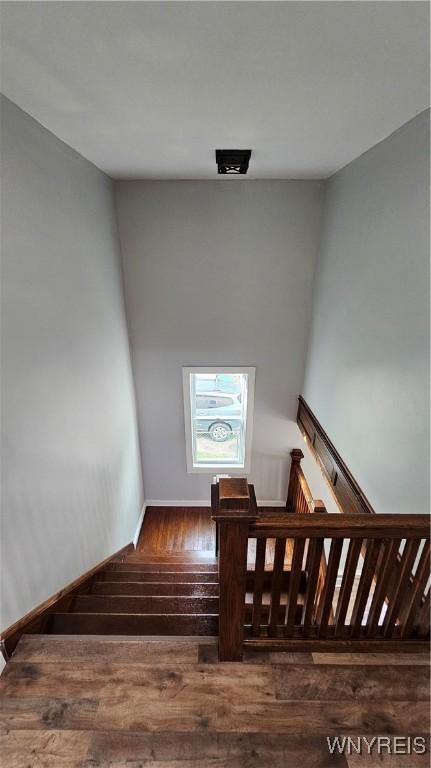 726 S Main St, Shelby, NY 14103 - stairway featuring hardwood / wood-style floors and baseboards